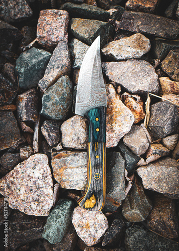 handmade knife on the rocks
