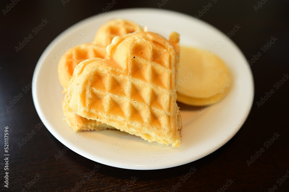 waffle and pancake on white plate. waffle and pancake on white plate.