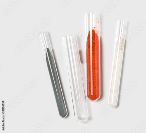 Closeup chemical ingredient on white laboratory table. Zinc Powder, Potassium Ferricyanide and Cetyl Esters Wax in test tube. photo