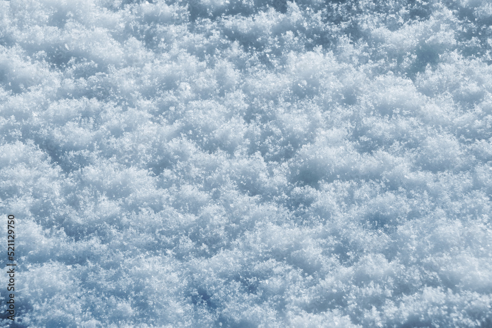 Texture of snow in sunny weather. Snow cover with snow crystals Texture of snow in sunny weather. Snow cover with snow crystals