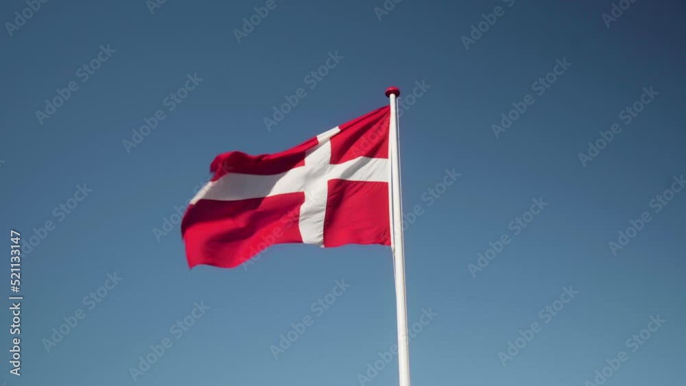 Denmark Flag Waving in the Wind in Slow Motion Close Up with blue sky background. 4k