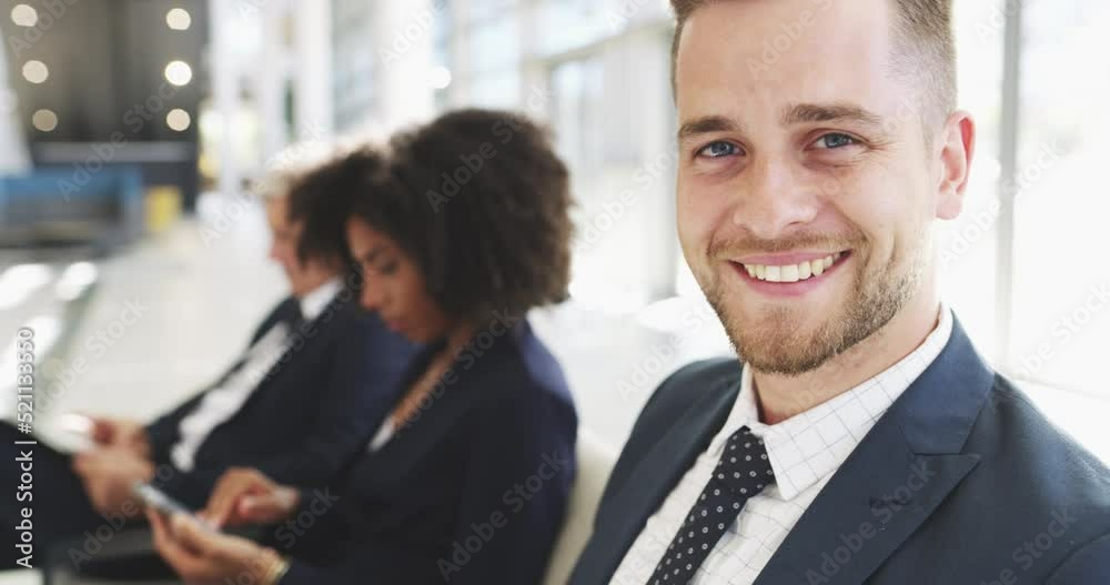 Young executive working on laptop from airport looking and smiling. Entrepreneur traveling on business trip, sitting and catching up on work. Professional satisfied with his work performance Young executive working on laptop from airport looking and smiling. Entrepreneur traveling on business trip, sitting and catching up on work. Professional satisfied with his work performance