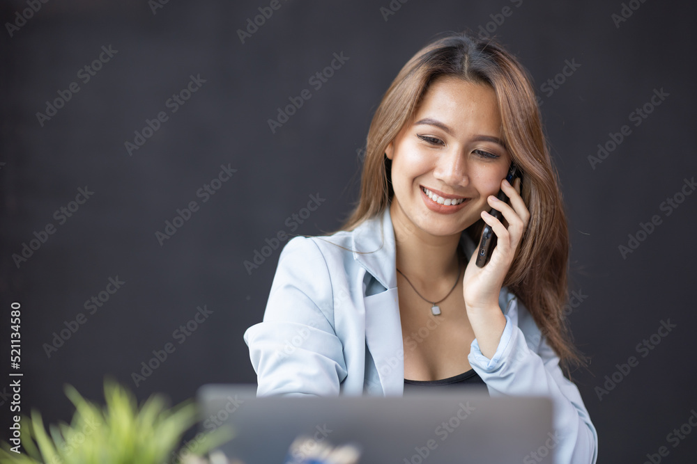 Busy business accountant Asian woman making call phone in home office and business working, Startup, report, tax, accounting, statistics, and analytic research concept Busy business accountant Asian woman making call phone in home office and business working, Startup, report, tax, accounting, statistics, and analytic research concept
