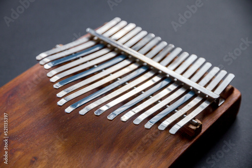Traditional wooden kalimba isolated on black