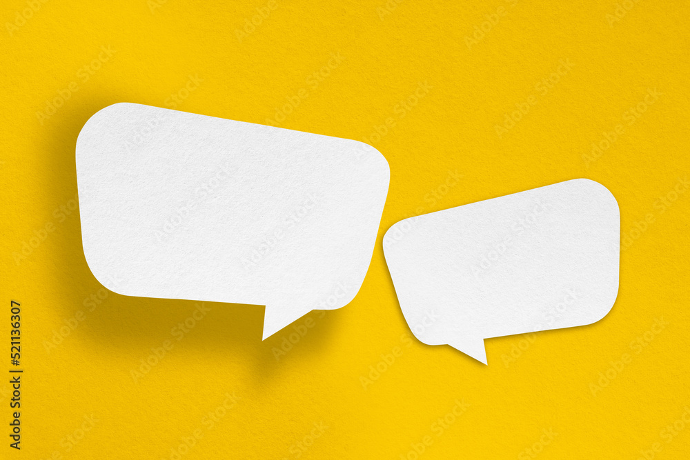 speech balloon shape white paper isolated on yellow background speech balloon shape white paper isolated on yellow background