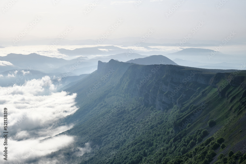 Sierra de Andia (Mount Beriain) in the early morning with a sea of ​​clouds covering the valley, Sierra de Andia, Navarra, Spain