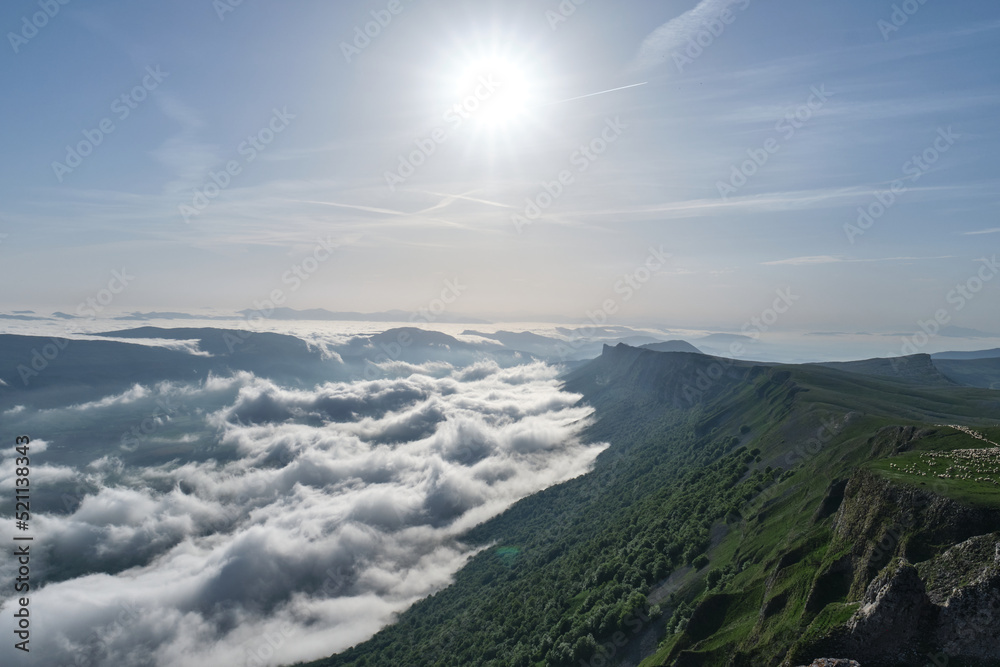 Sierra de Andia (Mount Beriain) in the early morning with a sea of clouds covering the valley, Sierra de Andia, Navarra, Spain Sierra de Andia (Mount Beriain) in the early morning with a sea of clouds covering the valley, Sierra de Andia, Navarra, Spain