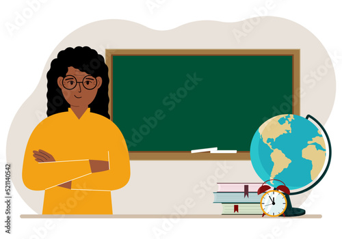 Female teacher near the blackboard. The concept of education, teaching, teacher's day.