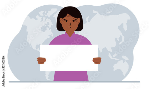 The concept of world attention. A woman holds a white poster in his hands against the background of a world map.