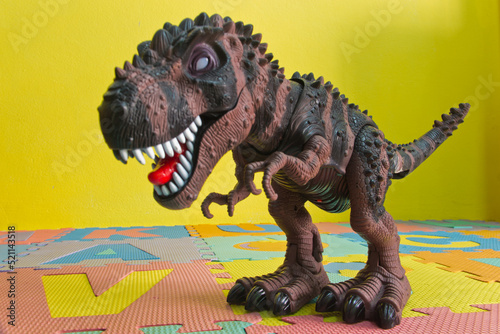 Fototapeta Naklejka Na Ścianę i Meble -  Tyrannosaurus T-rex, plastic toy, dinosaur with milkshake isolated on white background, resin figurine. Fast food and sweets love concept