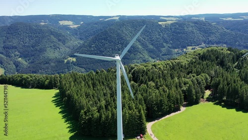 Aerial video of wind power plant on the hilltop between fir trees. St. Peter, Black forest, Germany.
Concept  for regenerative energy and energy crisis.