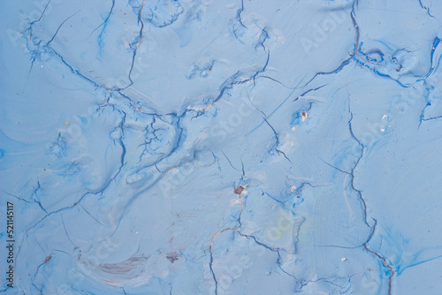 Dry blue oil paint cracks and crevices texture for background