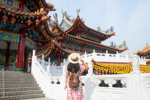 Photography Woman tourist is sightseeing and traveling inside Thean Hou Temple in Kuala Lumpur, Malaysia