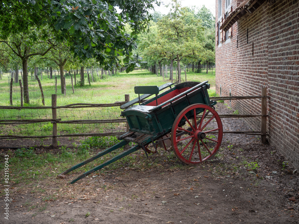 Green antique handcart with red wheels from the 1880s to the 1930s