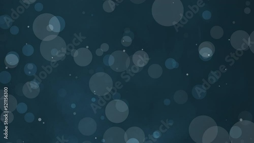 Blue blur bokeh particles in dark blue background