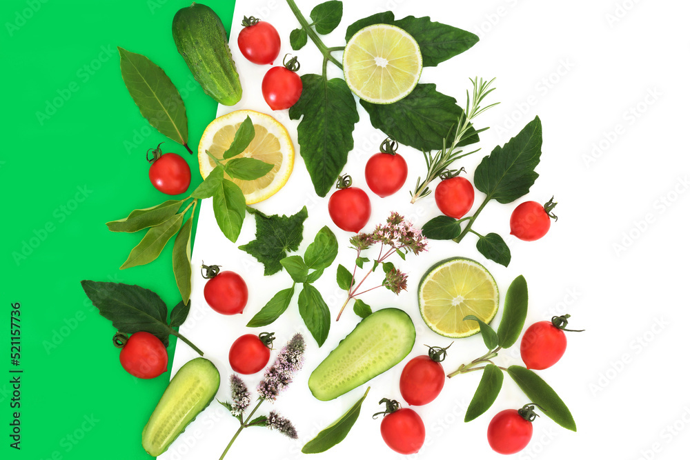 Naklejka premium Fresh organic salad vegetables and herbs with leaves. Local grown produce health food very high in antioxidants, fibre, vitamin c, anthocyanins, lycopene on green and white background.