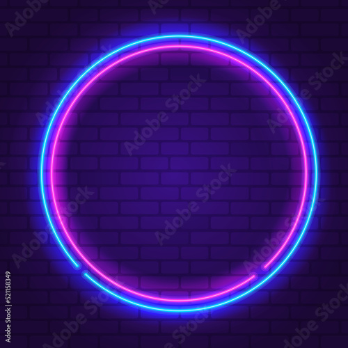 Round neon frame Pink and Blue colors at purple brick wall background. Glowing neon frame in retro 80s - 90s style. Colored neon sign with empty space. Editable Vector
