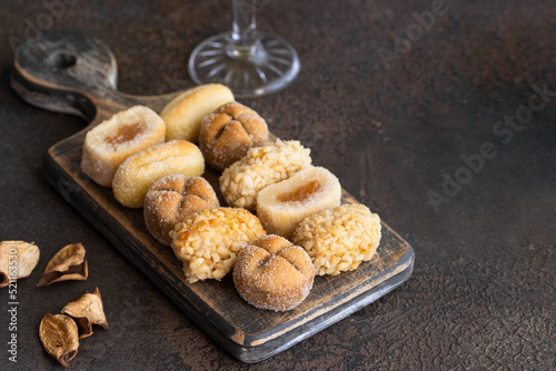 Panelles assortment on wooden cut board, typical sweets in Catalonia ,Spain for All Saints Day. photo