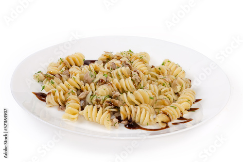 Prepared spiral pasta with chopped meat and dill on dish