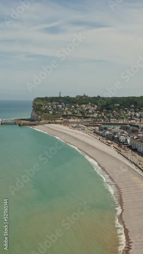 Wallpaper Mural A town located on the coast among sheer cliffs with a natural arch Torontodigital.ca