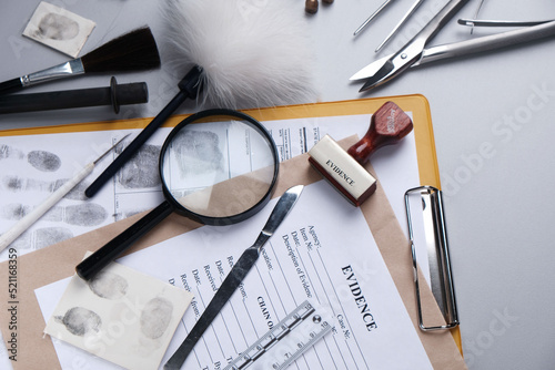 police crime lab, items for forensics and evidence on a gray background