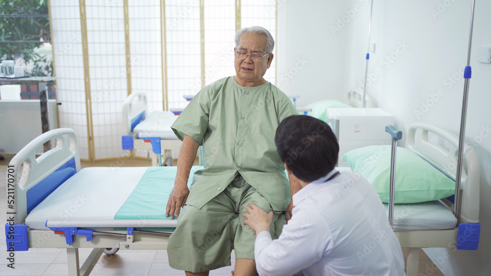 Obraz premium Happy old elderly Asian patient or pensioner and a doctor smiling, doing exercise, working out in nursing home in hospital. Senior people lifestyle activity recreation. Health care physical therapy.