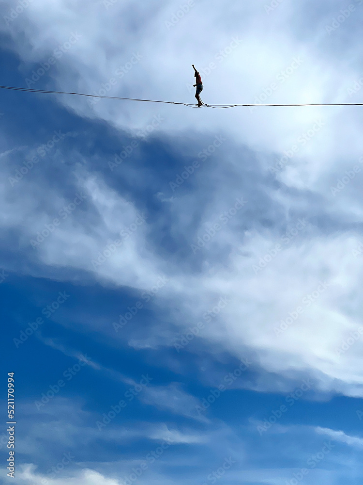 French tightrope walker Nathan Paulin walks on a 950 meters long slackline, 50 meters over Geneva Lake between the right and left banks of the city during an event part of the Swiss National Day. French tightrope walker Nathan Paulin walks on a 950 meters long slackline, 50 meters over Geneva Lake between the right and left banks of the city during an event part of the Swiss National Day.