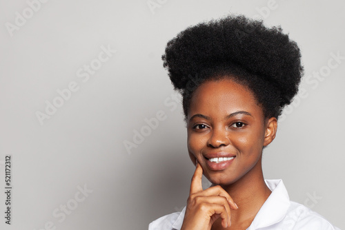 Happy pretty woman thinking against white wall banner background