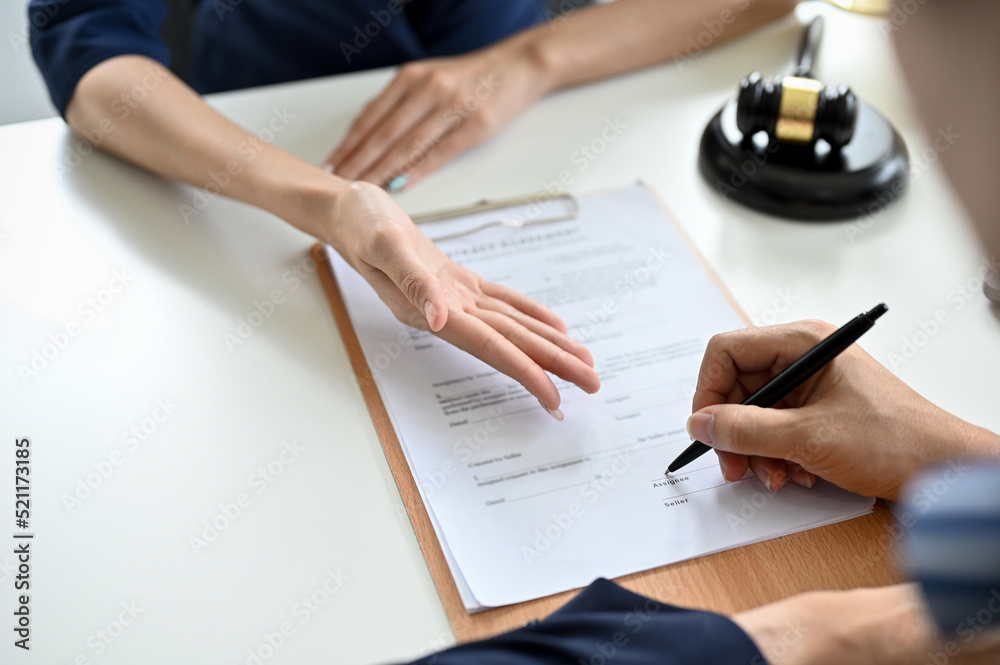Cropped, A male client sign his signature on a contract agreement paper