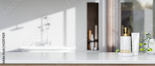 Bathroom tabletop with shampoo bottle  soap  and copy space over blurred elegance bathroom