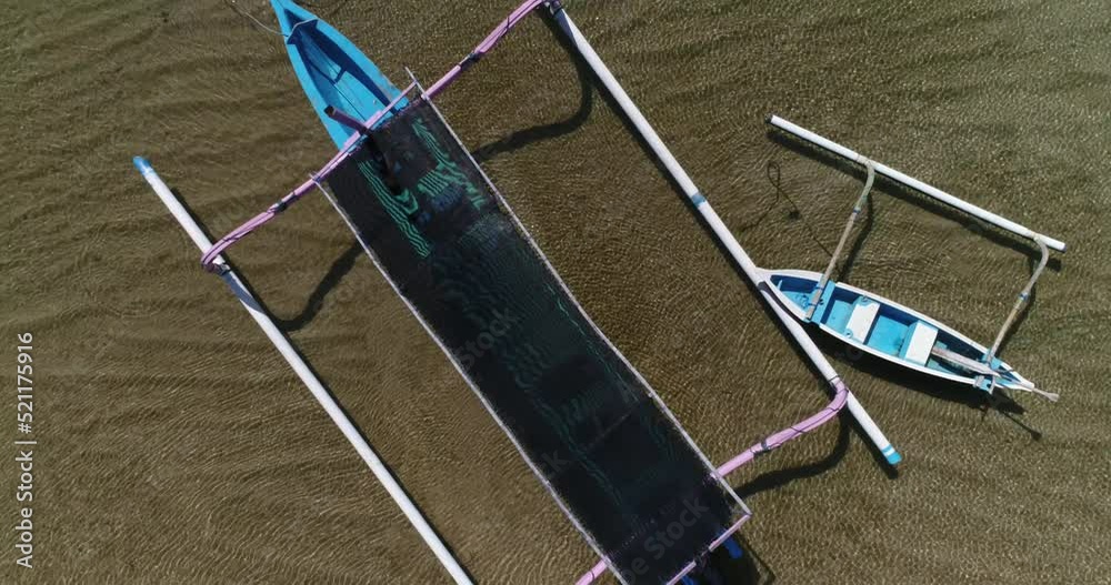 Aerial shot of small traditional indonesian boats parked on Mertasari beach in Sanur. Aerial shot of small traditional indonesian boats parked on Mertasari beach in Sanur.
