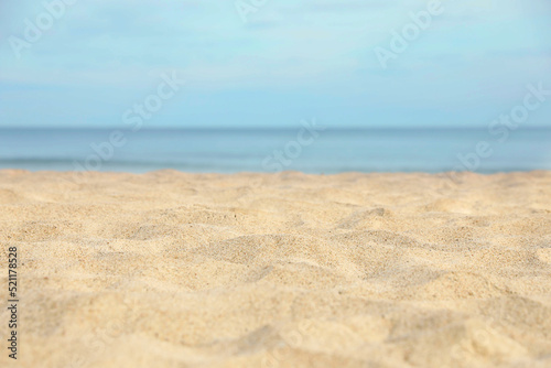 Closeup view of sandy beach near sea