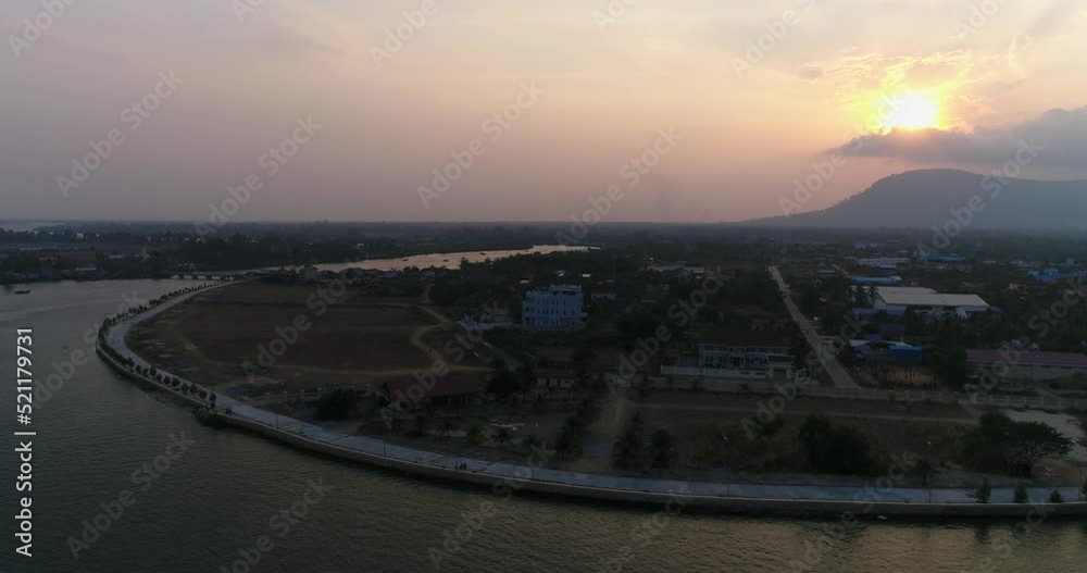 Aerial shot of the western part of Kampot city with the Praek Tuek Chhu river at sunset Aerial shot of the western part of Kampot city with the Praek Tuek Chhu river at sunset