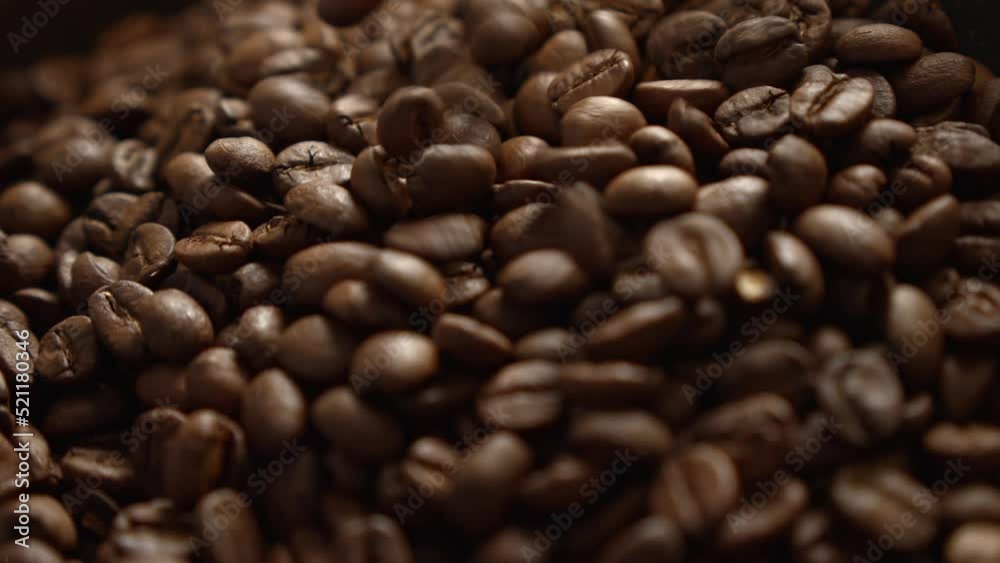Coffee beans falling into a pile. Coffee beans falling into a pile.