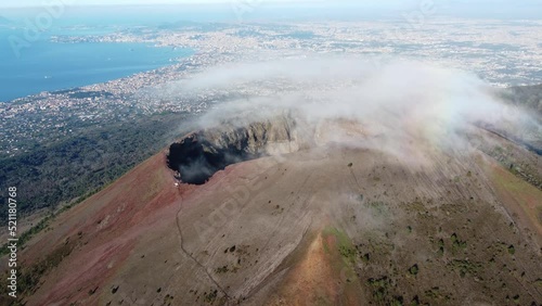 Wallpaper Mural Aerial view of volcano Mount Vesuvius, rough volcanic terrain inside crater on top of mountain - panorama of Naples from above, Italy, Europe. Epic reveal. Drone footage 4K. Cloud over volcano. Torontodigital.ca