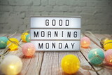 Good Morning Monday text on lightbox on wooden background