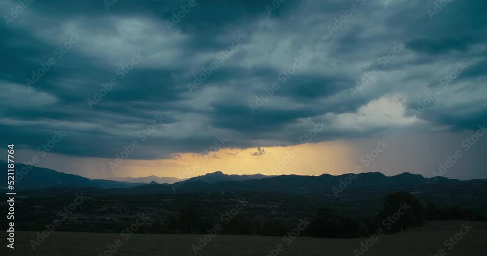 Timelapse stormy cloudscape on rural environment with mountains in horizon. Hyperlapse of rain at sunset on epic nature scenery. Timelapse stormy cloudscape on rural environment with mountains in horizon. Hyperlapse of rain at sunset on epic nature scenery.