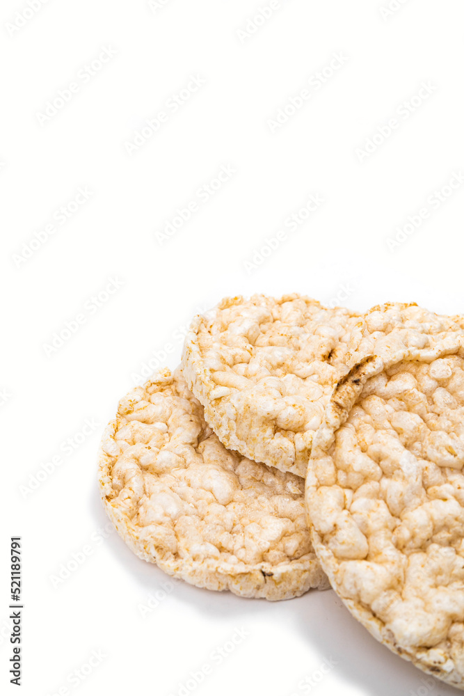 Exquisite round rice crackers on a white surface. Copy Space. Healthy eating. Exquisite round rice crackers on a white surface. Copy Space. Healthy eating.