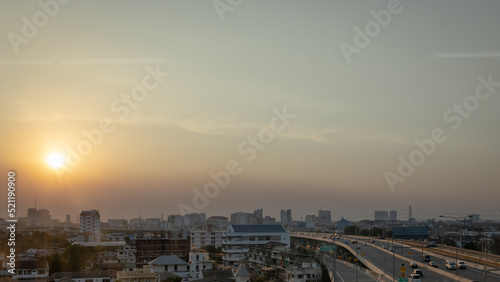Panorama view of city landscape of modern skyscraper building and office tower in business district during sunset in the evening with clear blue sky. Bangkok metropolitan, capital city of Thailand.