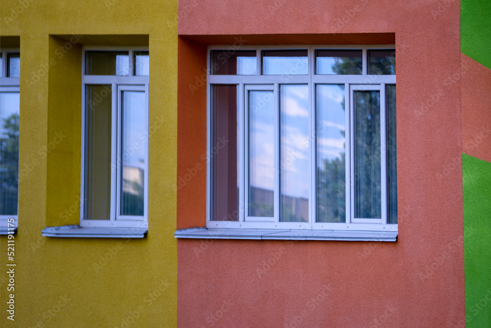bright school building kindergarten green yellow school background windows minimalism in Ukraine 
in Kyiv