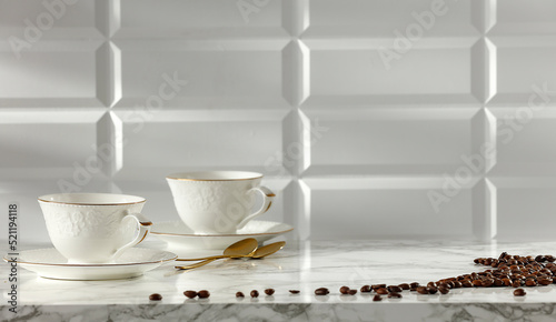 Coffee in the kitchen on a marble table in the sunshine with free space