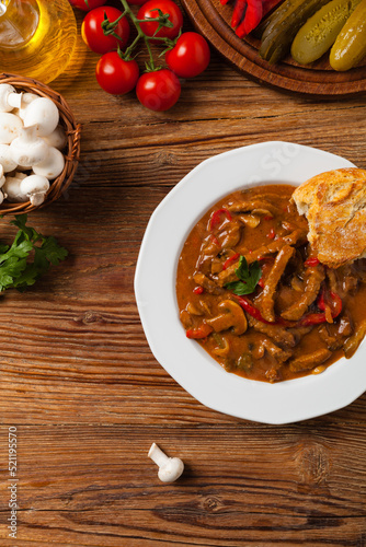 Boeuf, Stroganow, Strogonow. Classic, Russian beef stew. Served on a white plate. Top view. Natural background. photo