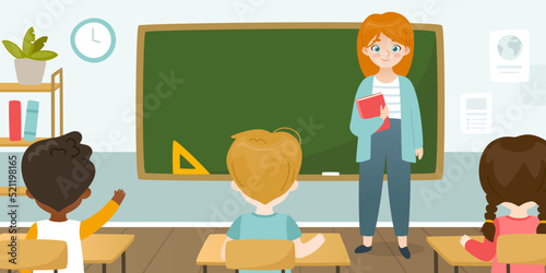 Cute teacher leads the lesson in front of the blackboard. Classroom with teacher and sitting pupils.