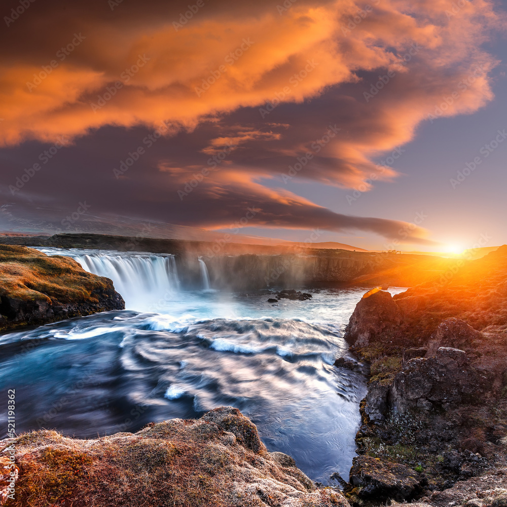 Scenic image of Iceland at sunset. Godafoss, One of the most famous waterfalls in Iceland. Amazing nature scenery. Iconic location for landscape photographers. Travel concept. Artistic Creative image.