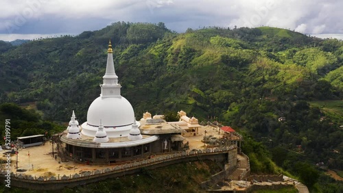 Top view of Buddhist temple in a mountain province on top of a mountain. Mahamevnawa Buddhist Monastery. Bandarawela, Sri Lanka. photo