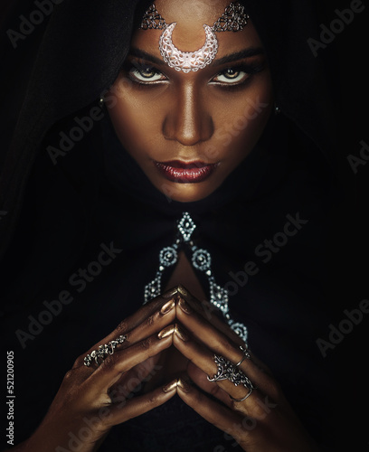 Fantasy portrait african american sexy woman queen priestess of night. tiara crown silver moon hood on head. Creative black design. Voodoo witch gothic girl sexy looks into camera. halloween costume.