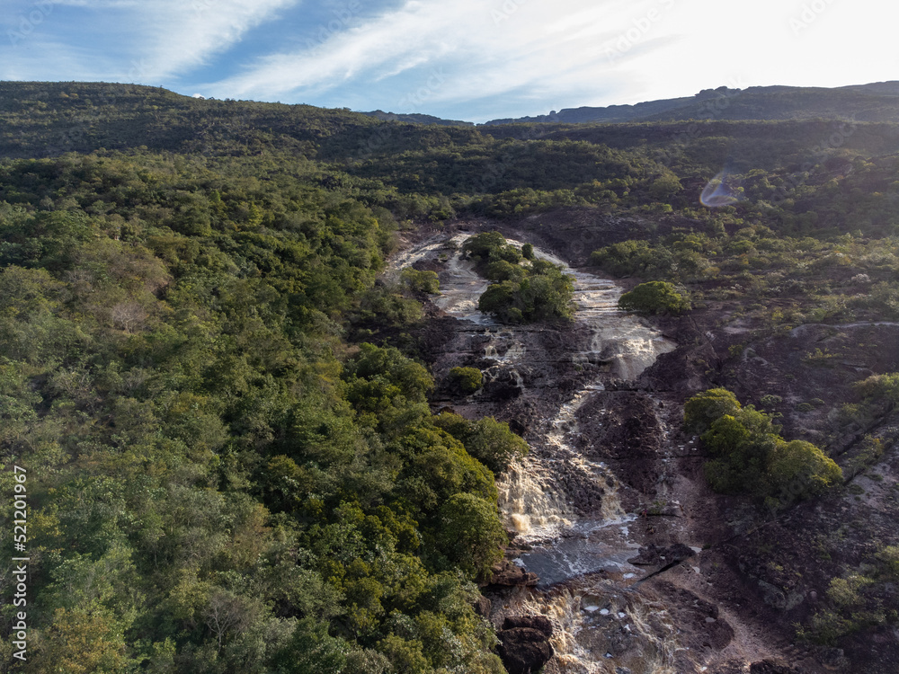 Beautiful river in waterfall with rocks in the middle of mountainous nature - Chapada Diamantina, Lençóis, Bahia, Brazil Beautiful river in waterfall with rocks in the middle of mountainous nature - Chapada Diamantina, Lençóis, Bahia, Brazil