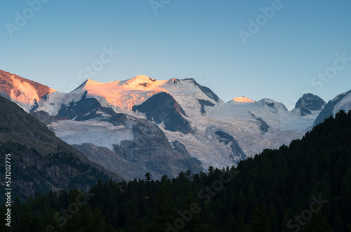 Last, warm sunlight on the Bernina mountain range in the Morteratsch valley in Switzerland.