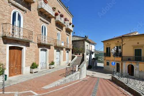 Fototapeta Naklejka Na Ścianę i Meble -  A small street between the old houses of Savignano Irpino, one of the most beautiful villages in Italy.