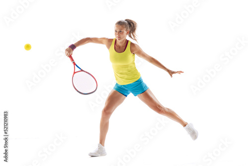 Dymanic portrait of sportive woman, professional tennis player in motion, training isolated over white studio background